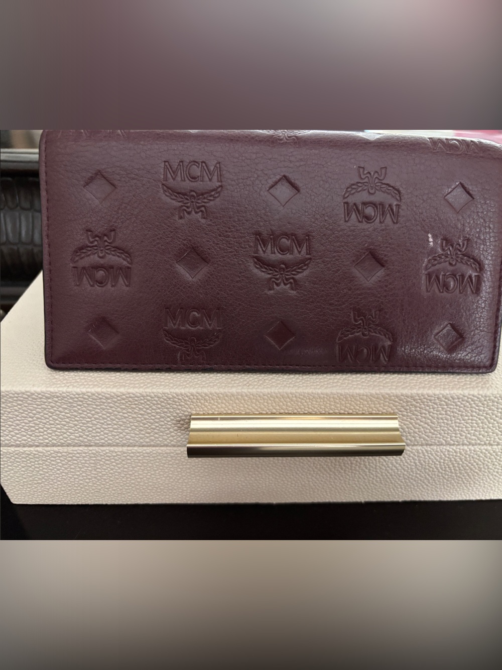 MCM Embossed Bifold Wallet in Plum with Gold Accent